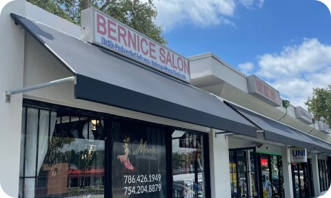 Storefront awnings with flat bar design for retail businesses